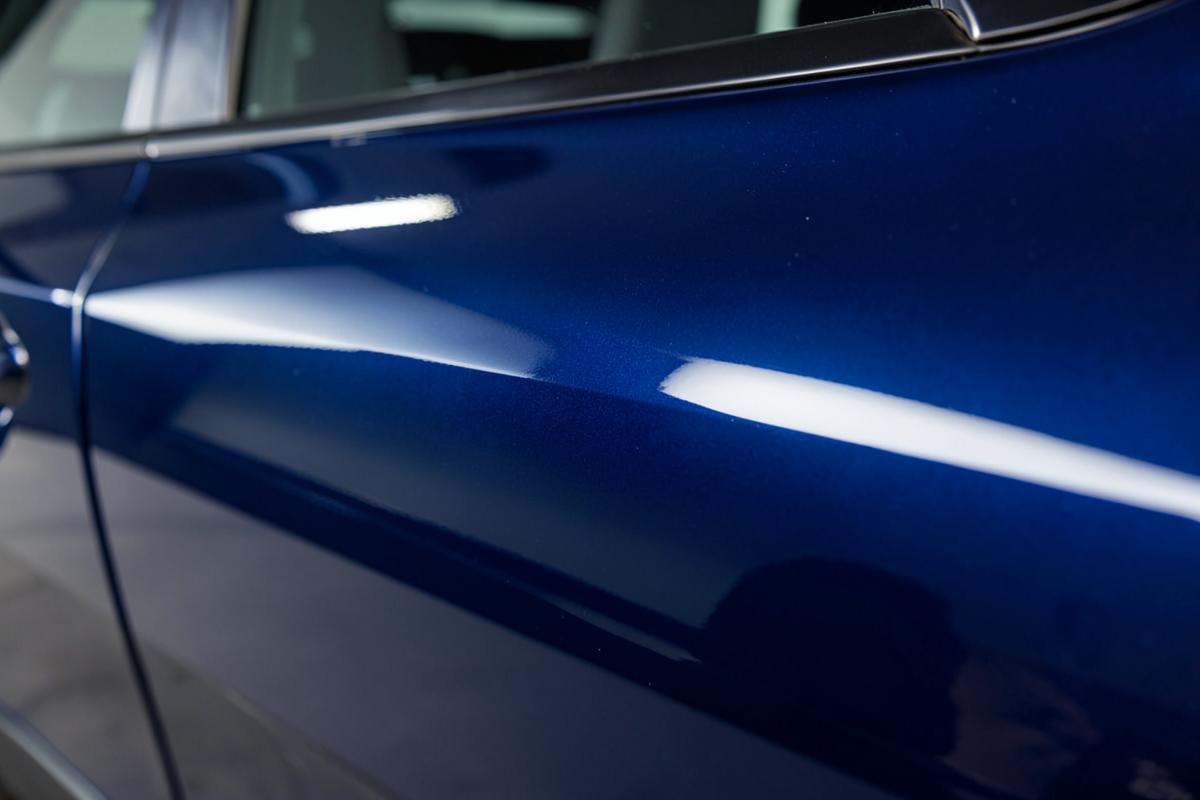 Deep glossy blue car paint after refinishing at Alex Foreign Motors